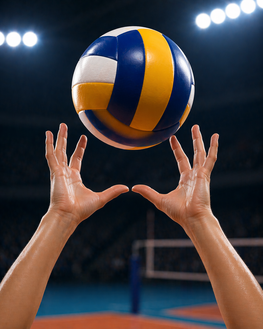 Hands in setting position with volleyball floating above under arena lights
